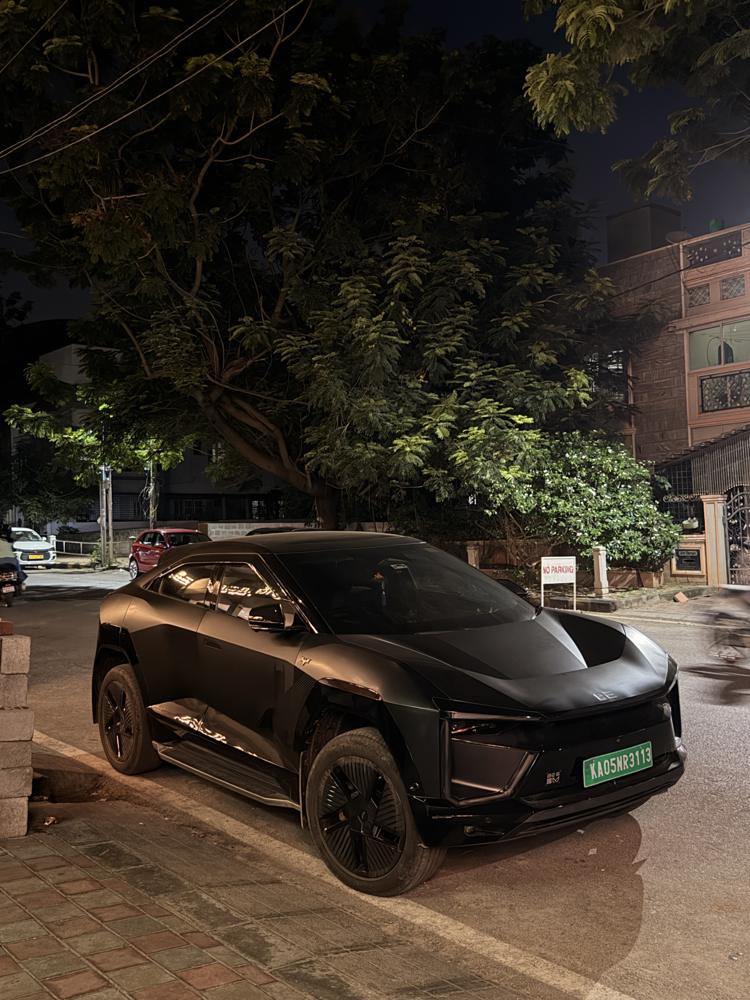 Black ev parked at night