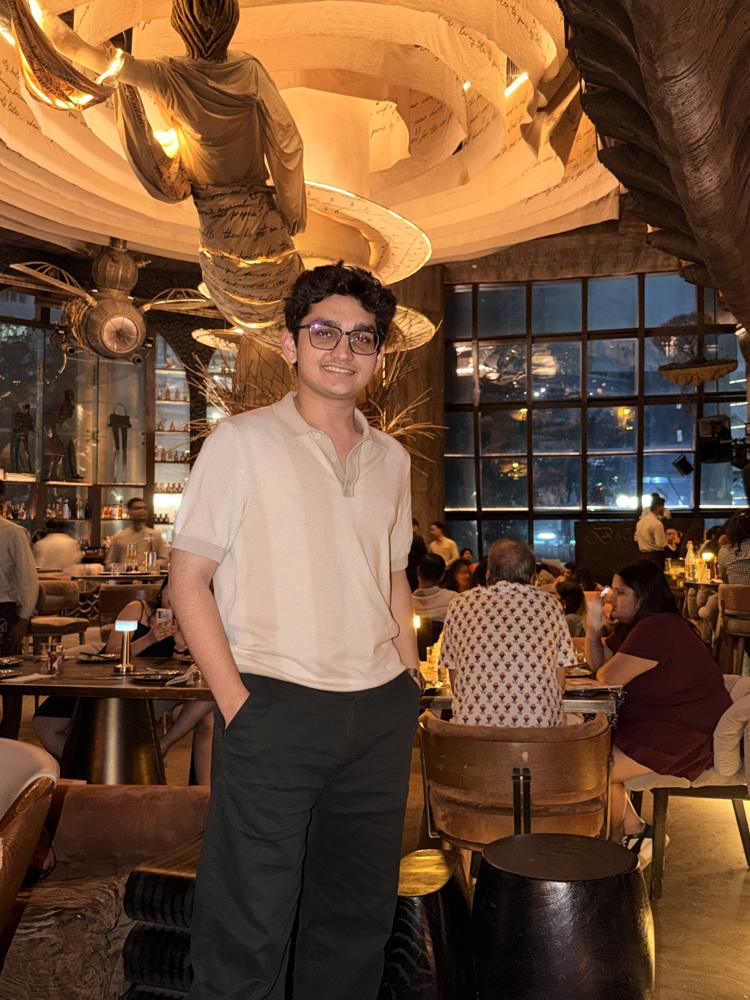Standing in restaurant cream polo