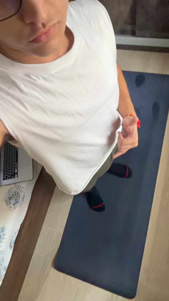 Selfie white tee on yoga mat face cropped
